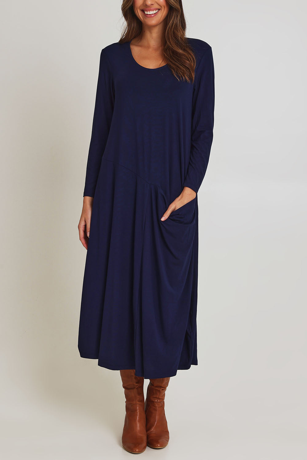 Model Madeline wearing size 10 of the Long Sleeve Pocket Dress in colour Navy (Blue), from the front, cropped image