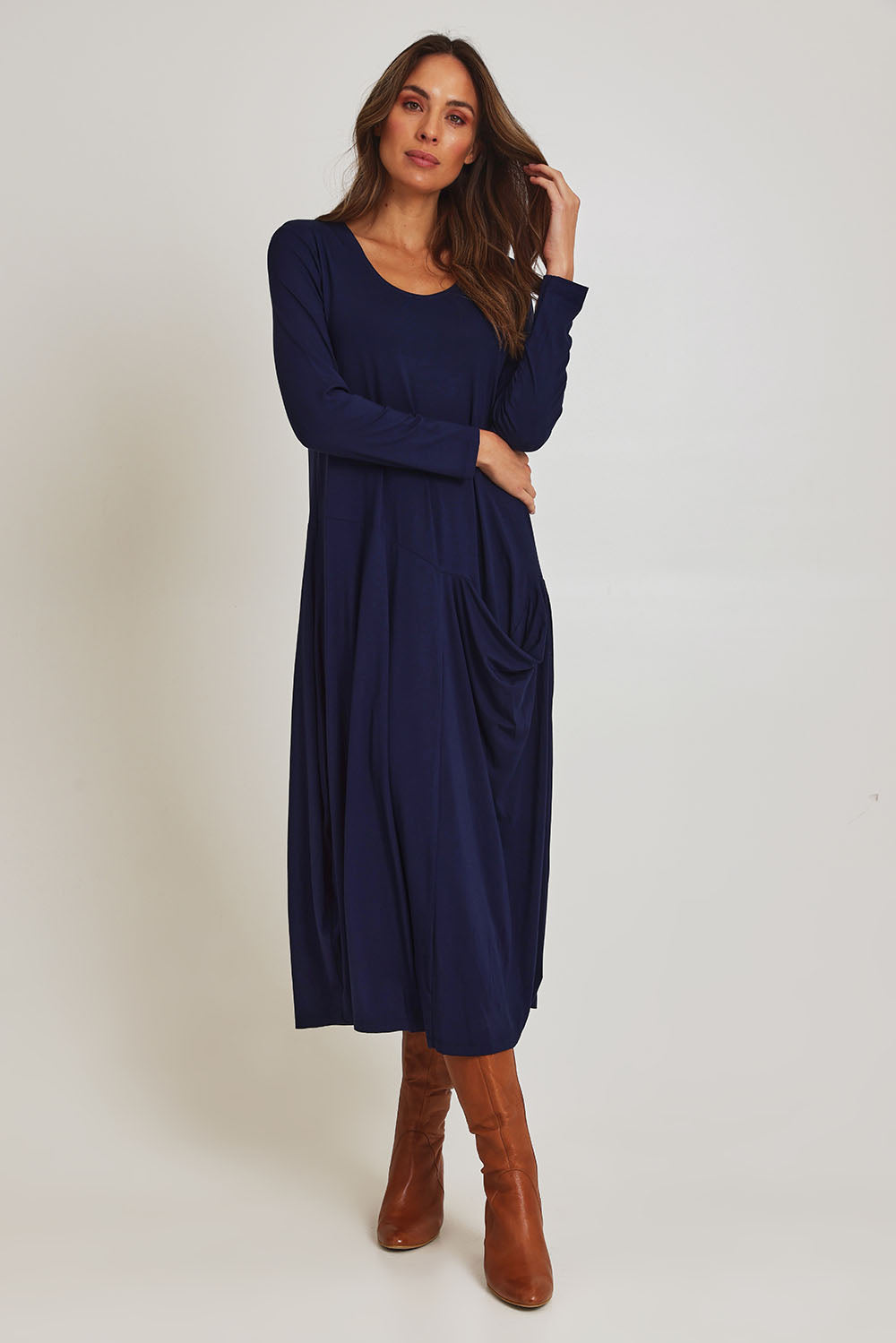 Model Madeline wearing size 10 of the Long Sleeve Pocket Dress in colour Navy (Blue), from the front, showing the whole outfit