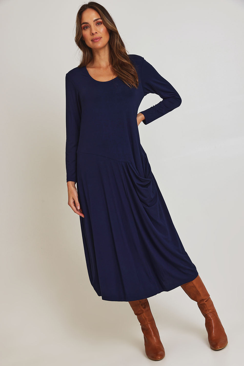 Model Madeline wearing size 10 of the Long Sleeve Pocket Dress in colour Navy (Blue), from the front, showing the whole outfit