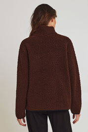 Model Madeline wearing size 10 of the Teddy Zippy Jacket in colour Choc, from the back