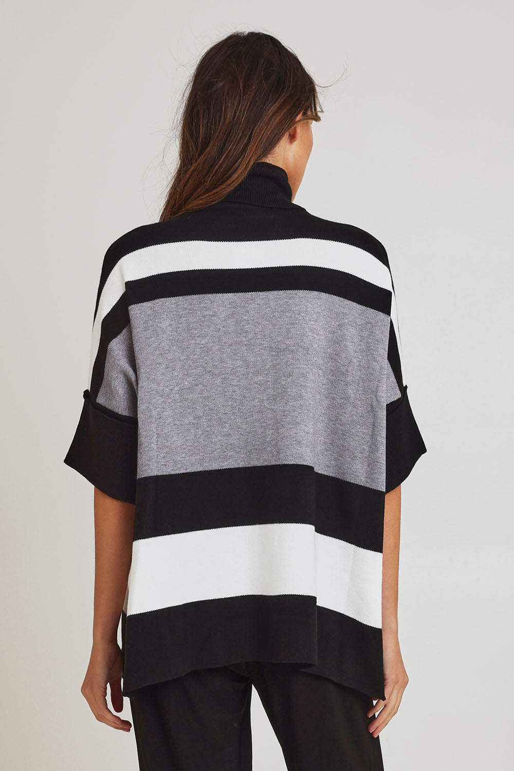 Model Madeline wearing size OneSize of the Stripe Polo Knit Pullover in colour Char (Grey), from the back