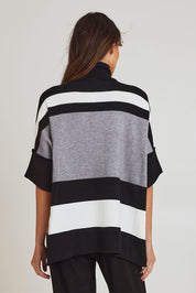 Model Madeline wearing size OneSize of the Stripe Polo Knit Pullover in colour Char (Grey), from the back