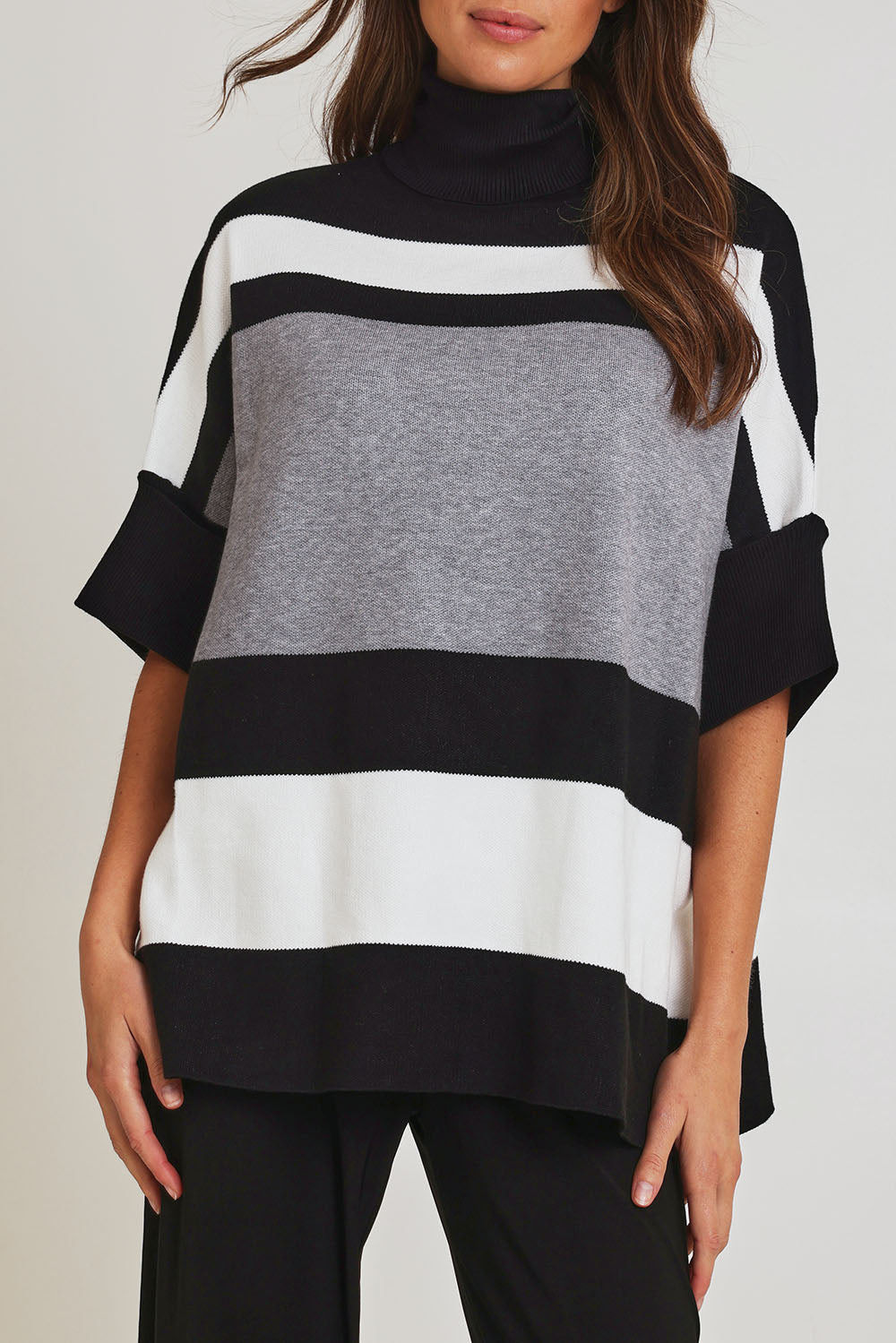 Model Madeline wearing size OneSize of the Stripe Polo Knit Pullover in colour Char (Grey), from the front, cropped image