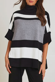 Model Madeline wearing size OneSize of the Stripe Polo Knit Pullover in colour Char (Grey), from the front, cropped image
