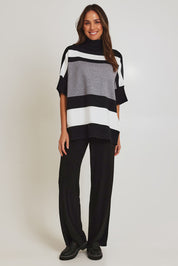 Model Madeline wearing size OneSize of the Stripe Polo Knit Pullover in colour Char (Grey), from the front, showing the whole outfit