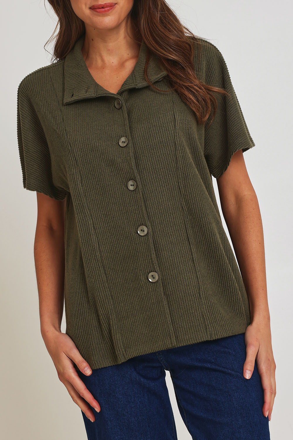 Model Madeline wearing size 10 of the Vesty Top in colour Khaki (Green), from the front, cropped image