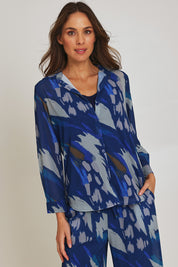 Model Madeline wearing size 10 of the Abstract Shirt in colour Blueprint (Blue), from the front, cropped image
