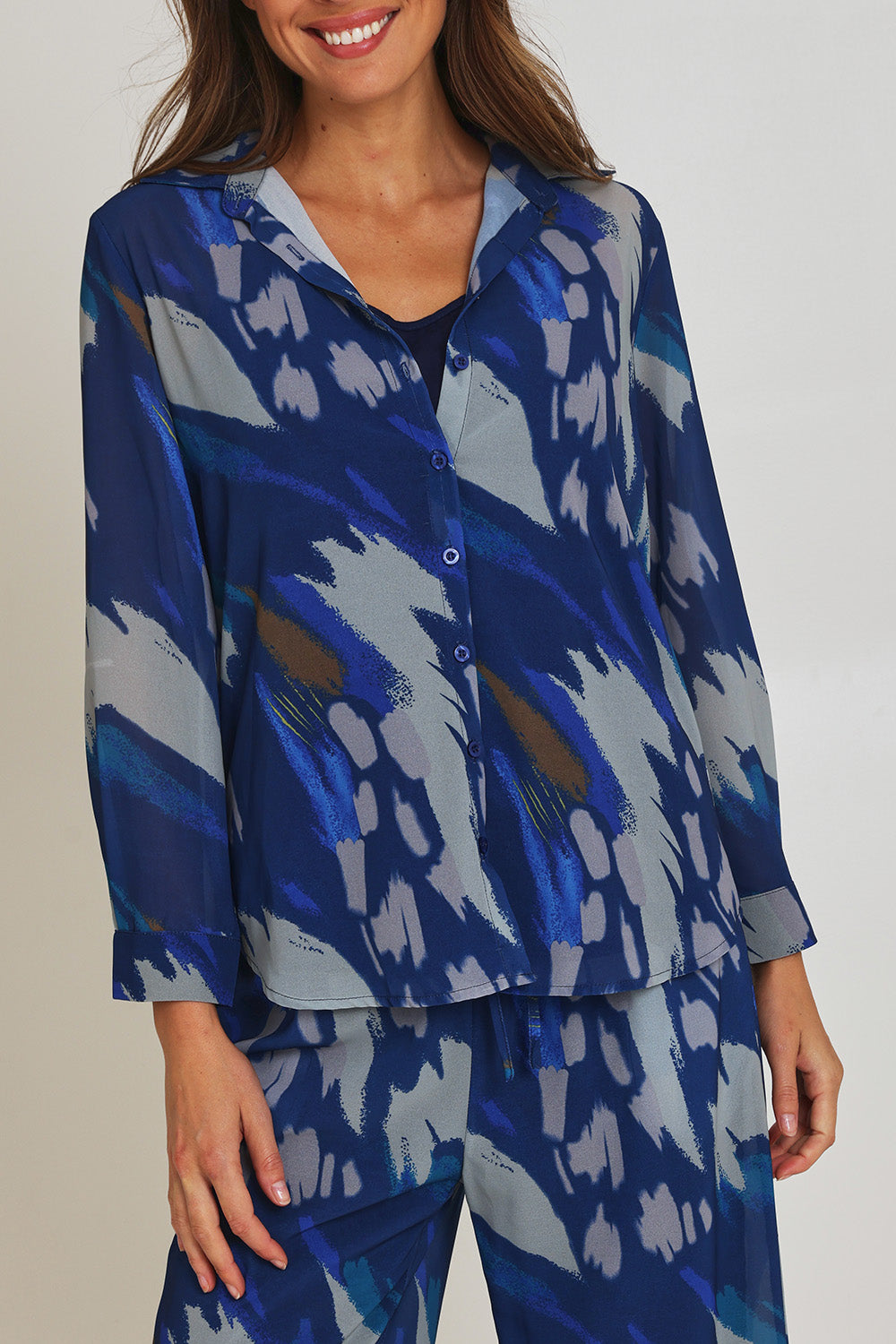 Model Madeline wearing size 10 of the Abstract Shirt in colour Blueprint (Blue), from the front, cropped image