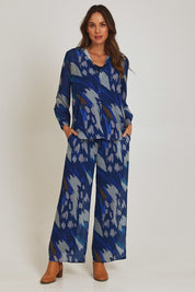 Model Madeline wearing size 10 of the Abstract Shirt in colour Blueprint (Blue), from the front, showing the whole outfit
