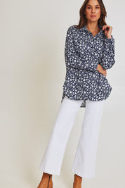 Model Madeline wearing size 10 of the Floral Scoop Cotton Shirt in colour Navywhite (Blue), from the front, showing the whole outfit