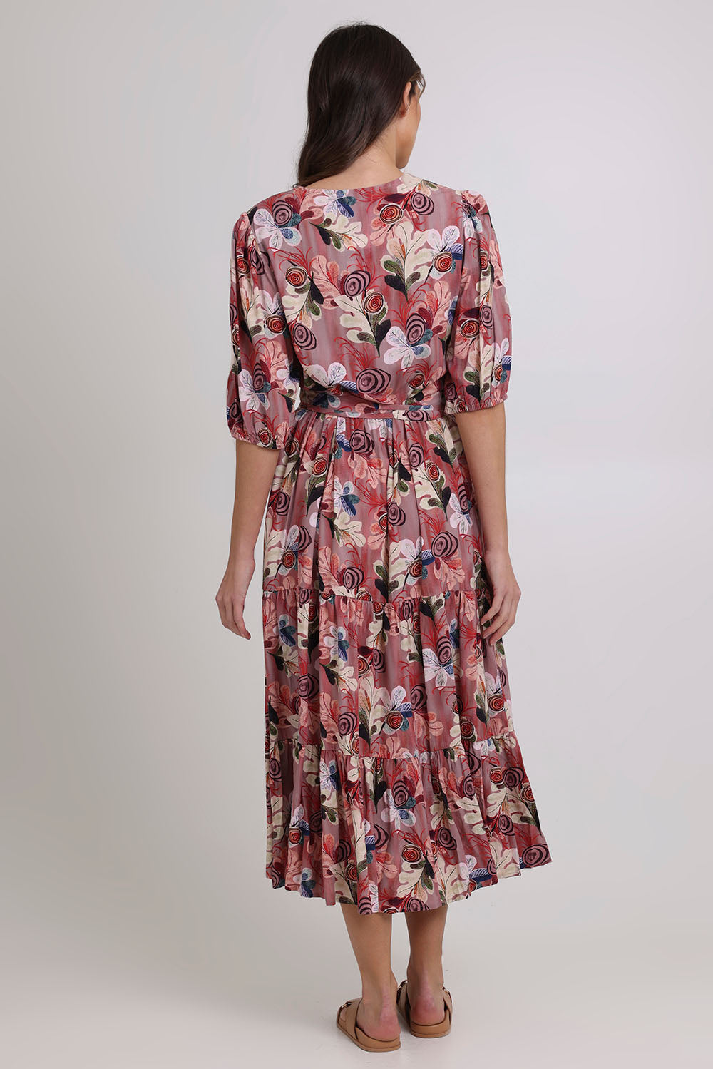 Model Madeline wearing size 10 of the Bombay Beauty Dress in colour Rose (Pink), from the front, cropped image