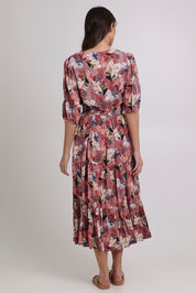 Model Madeline wearing size 10 of the Bombay Beauty Dress in colour Rose (Pink), from the front, cropped image