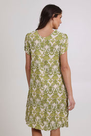 Model Madeline wearing size 10 of the Summer Sands Dress in colour Lime (Green), from the back