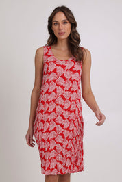 Model Madeline wearing size 10 of the Summer Sands Sleeveless Dress in colour Red (Red), from the front, cropped image