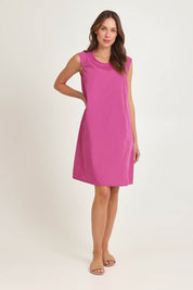Model Madeline wearing size 10 of the Get Smart Cotton Blend Dress in colour Berry (Pink), from the front, showing the whole outfit