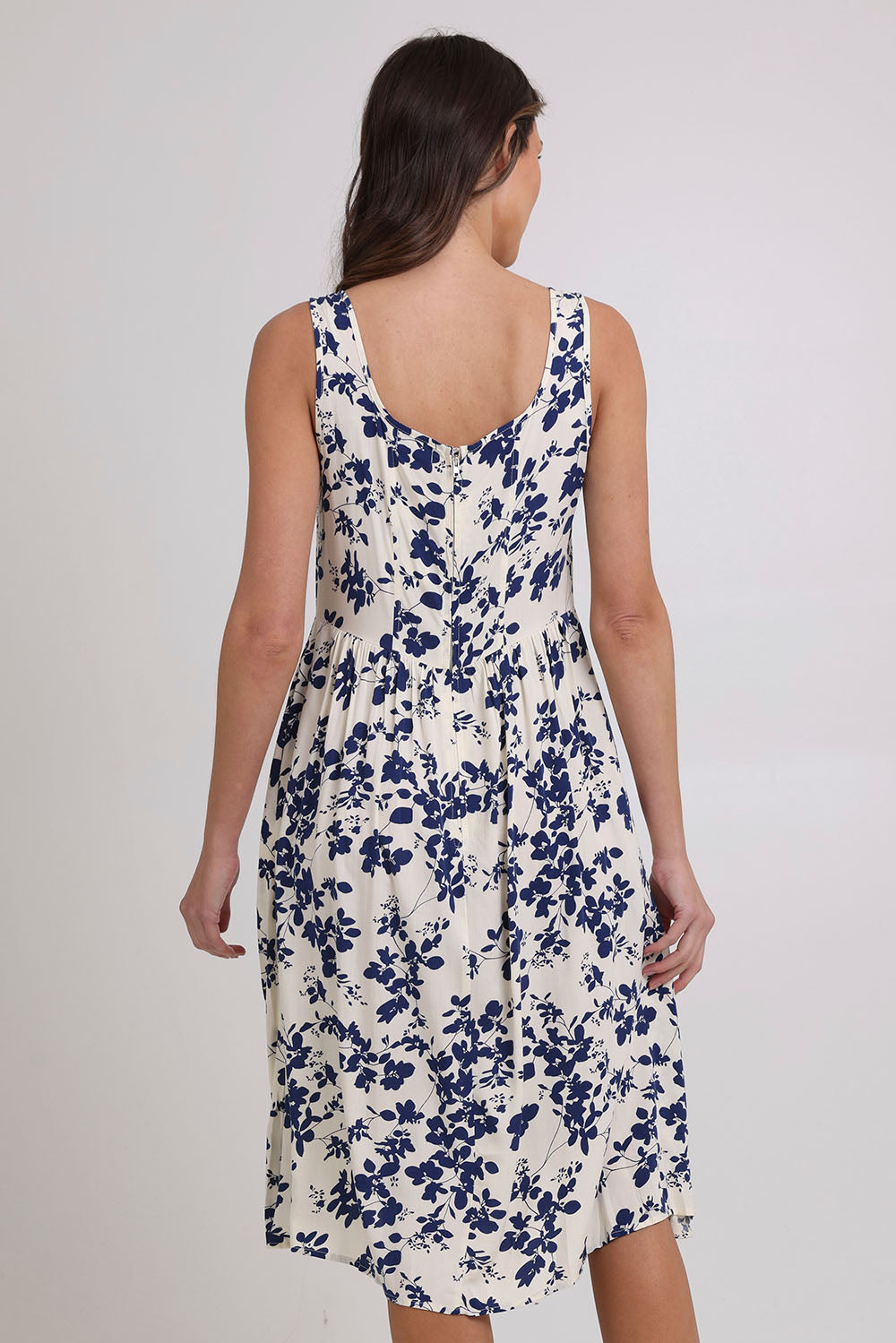 Model Madeline wearing size 10 of the Oakley Dress in colour Blue (Blue), from the back