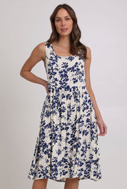 Model Madeline wearing size 10 of the Oakley Dress in colour Blue (Blue), from the front, cropped image