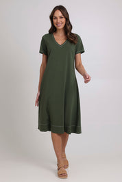 Model Madeline wearing size 10 of the Short Sleeve Contrast Dress in colour Khaki (Green), from the front, showing the whole outfit
