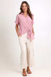 Model Madelinec wearing size 10 of the Linen Shores Pant – Sand in colour Sand, from the front