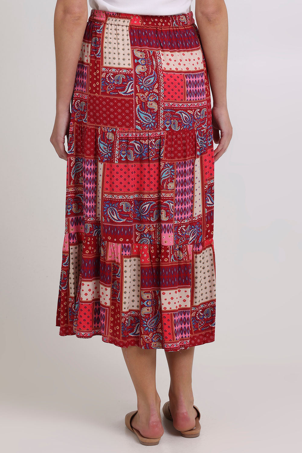 Model Madeline wearing size 10 of the Print Skirt in colour Pink (Pink), from the back