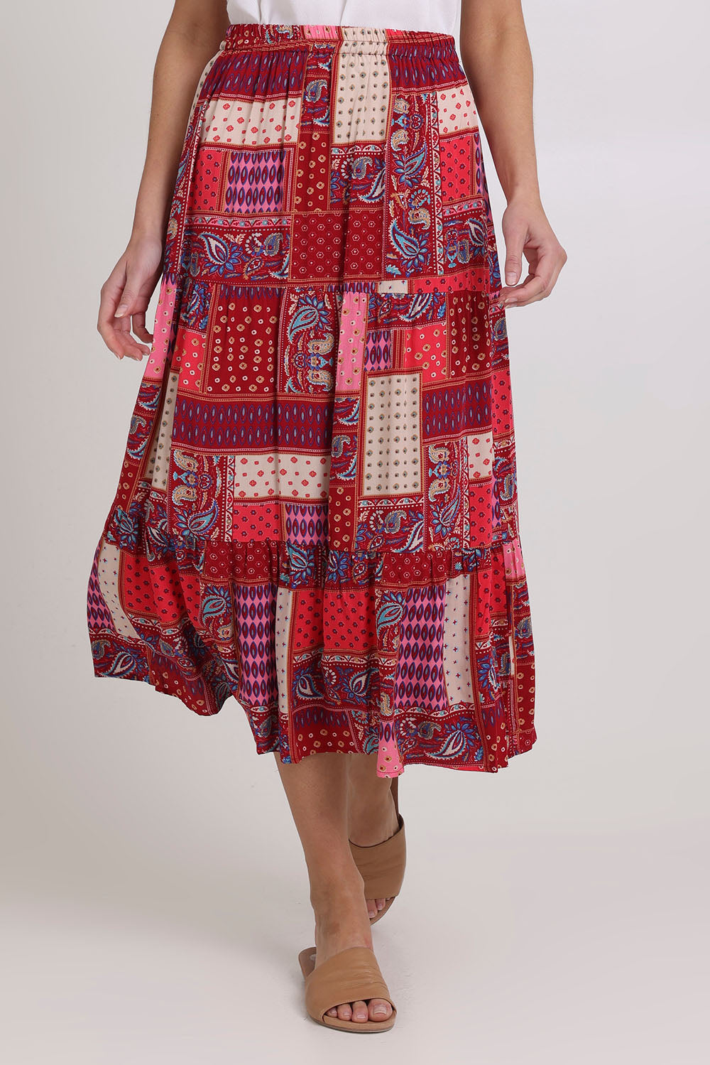 Model Madeline wearing size 10 of the Print Skirt in colour Pink (Pink), from the front, cropped image