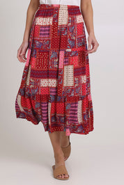 Model Madeline wearing size 10 of the Print Skirt in colour Pink (Pink), from the front, cropped image