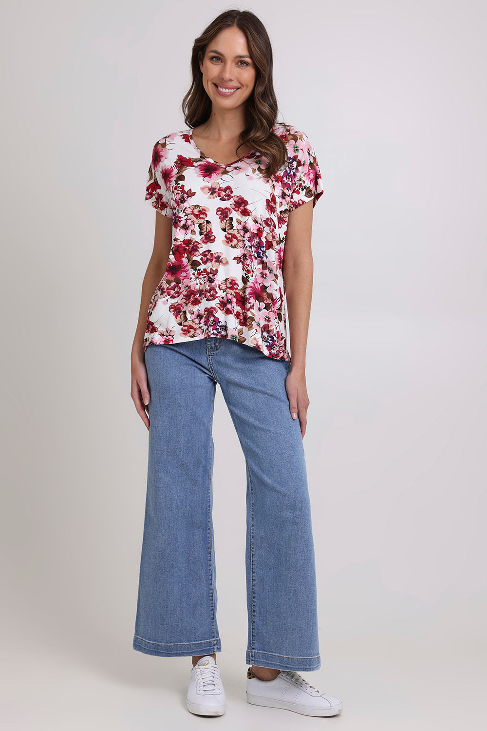Model Madeline wearing size 10 of the Perfect Vee Tee in colour Floral (Pink), from the front, showing the whole outfit
