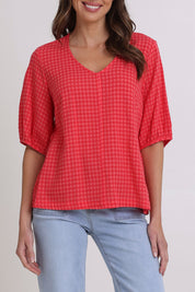 Model Madeline wearing size 10 of the Victoria Textured Cotton Blend Top in colour Coral (Pink), from the front, cropped image