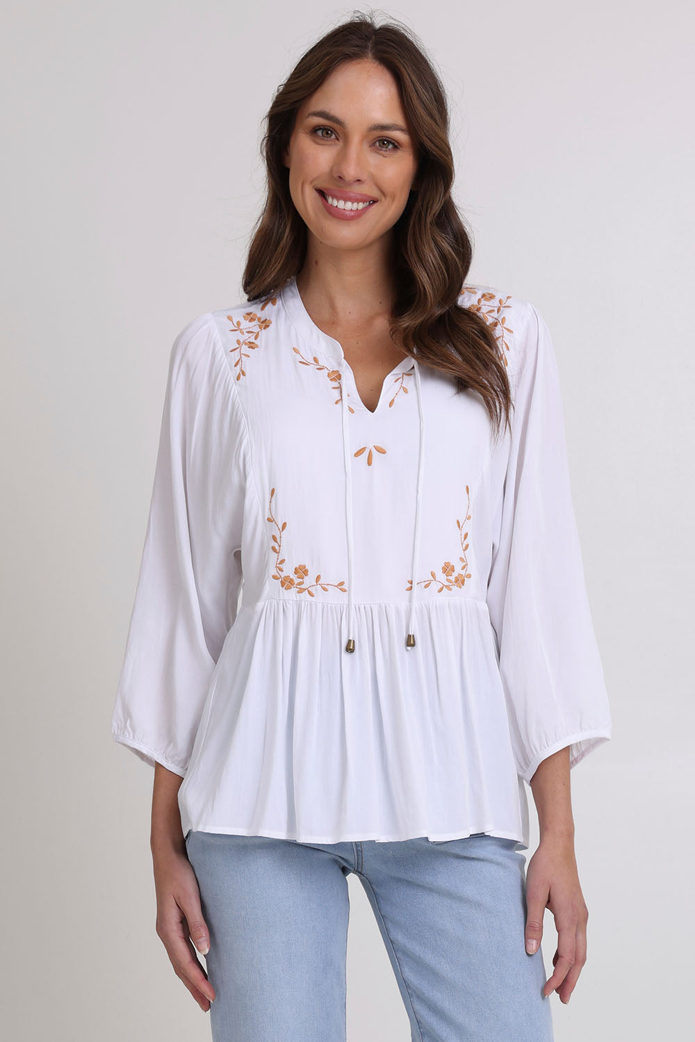 Model Madeline wearing size 10 of the Bombay Beauty Top in colour White (White), from the front, cropped image