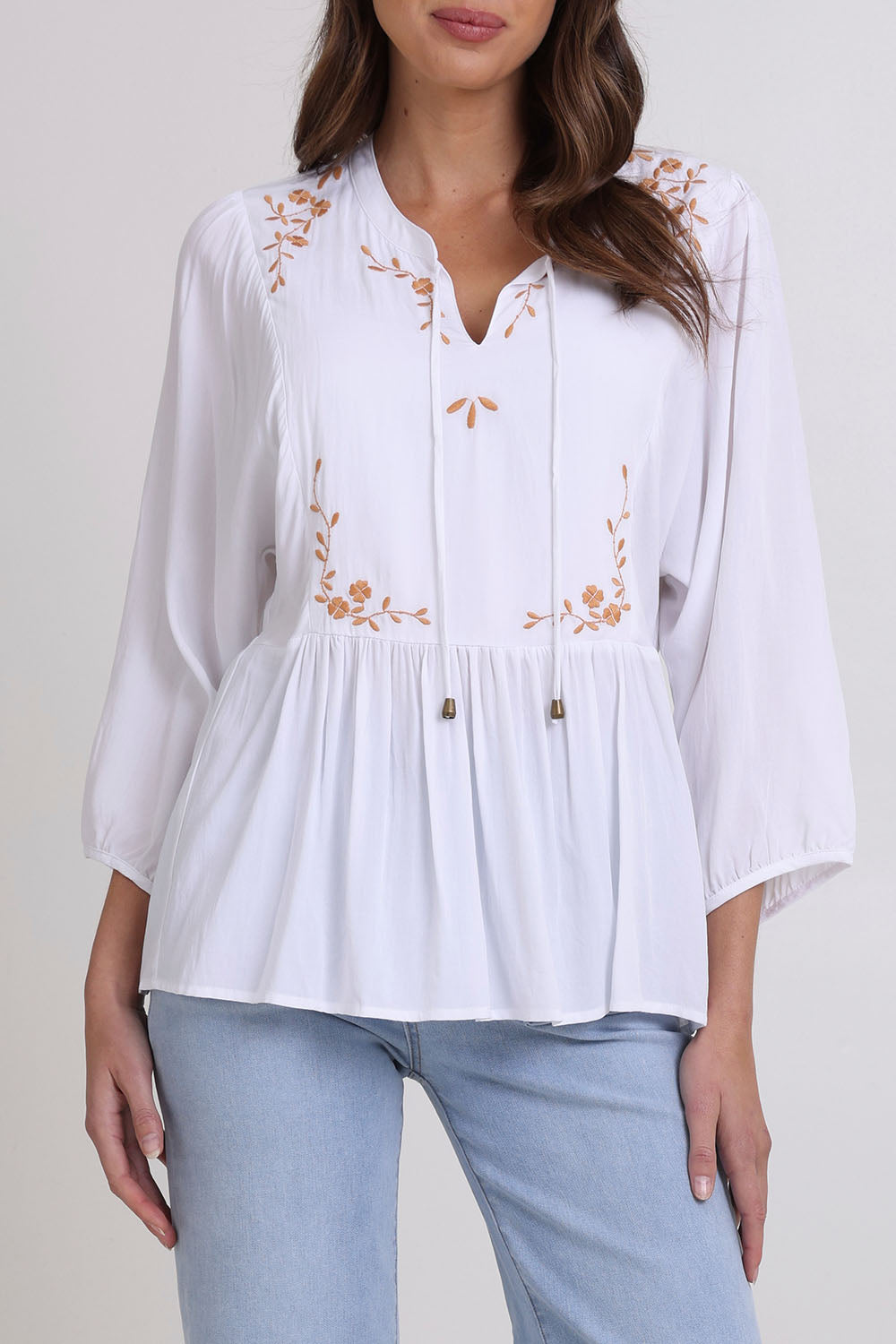 Model Madeline wearing size 10 of the Bombay Beauty Top in colour White (White), from the front, cropped image