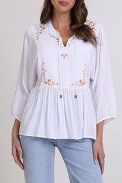 Model Madeline wearing size 10 of the Bombay Beauty Top in colour White (White), from the front, cropped image