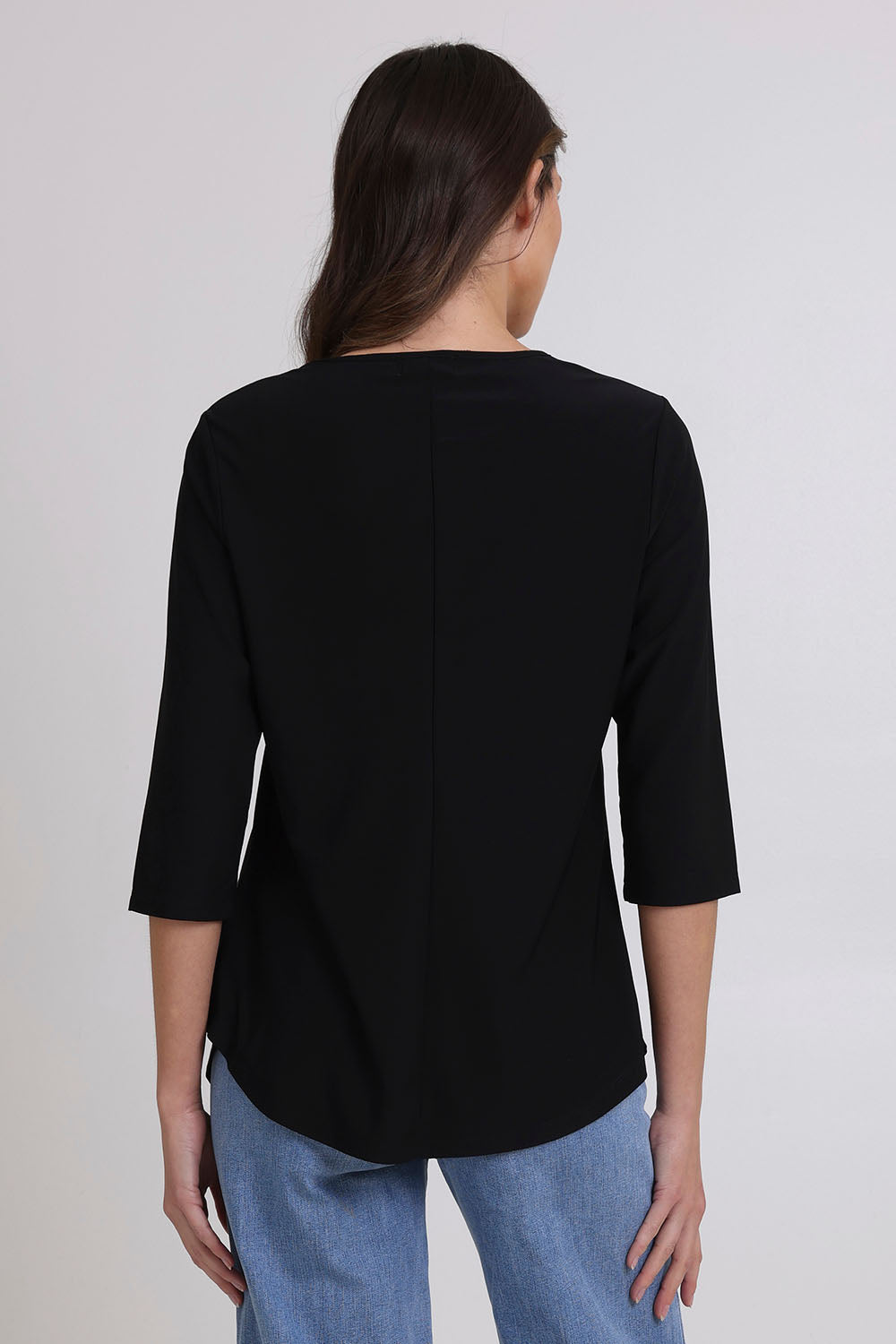 Model Madeline wearing size 10 of the Ring Top in colour Black (Black), from the back