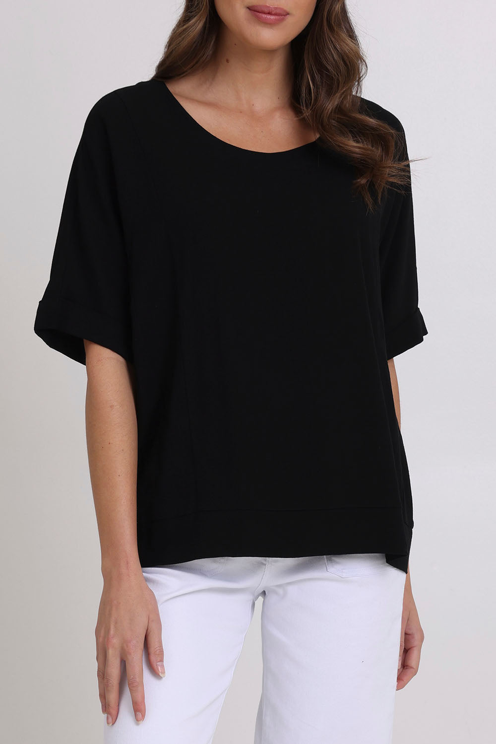 Model Madeline wearing size 10 of the Linen Shores Top in colour Black (Black), from the front, cropped image