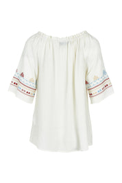 Product shot of the Oakley Embroidered Top in colour Ivory (White), from the back