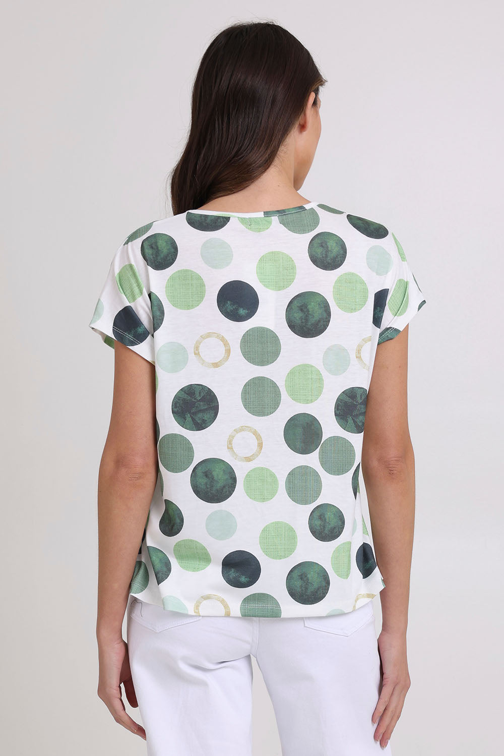 Model Madeline wearing size 10 of the Spotty Dotty Cap Sleeve Top in colour Whitegrn (Green), from the back