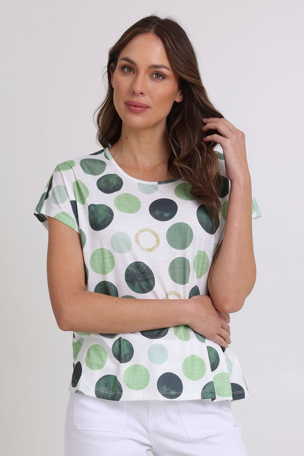 Model Madeline wearing size 10 of the Spotty Dotty Cap Sleeve Top in colour Whitegrn (Green), from the front, cropped image