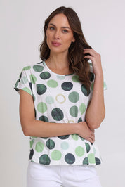 Model Madeline wearing size 10 of the Spotty Dotty Cap Sleeve Top in colour Whitegrn (Green), from the front, cropped image