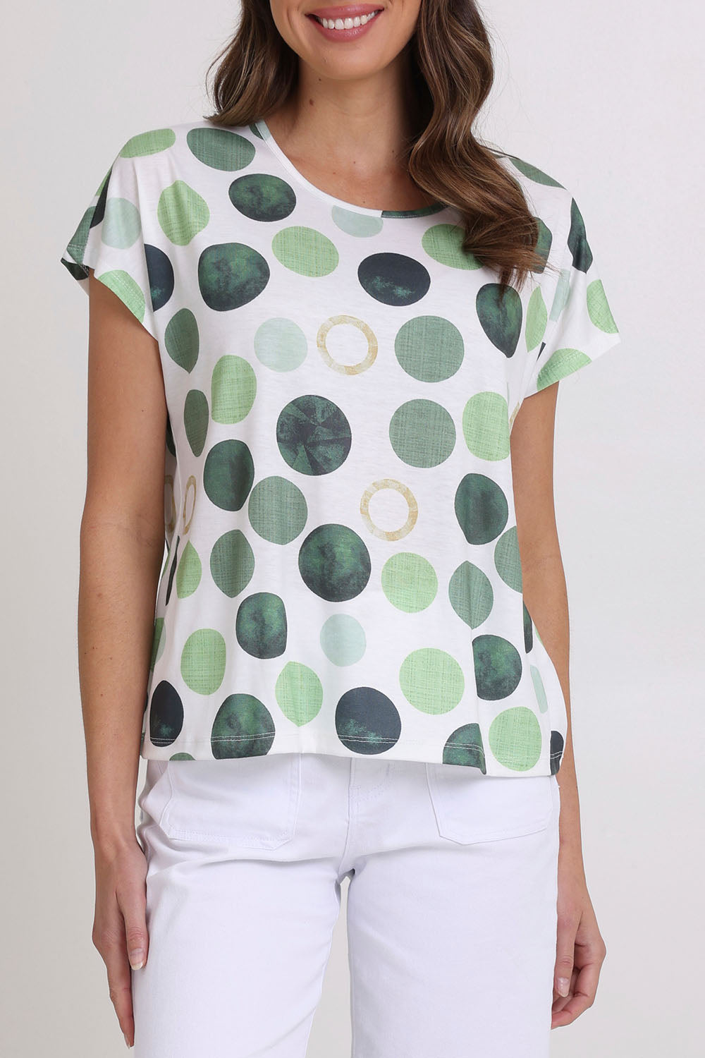 Model Madeline wearing size 10 of the Spotty Dotty Cap Sleeve Top in colour Whitegrn (Green), from the front, cropped image