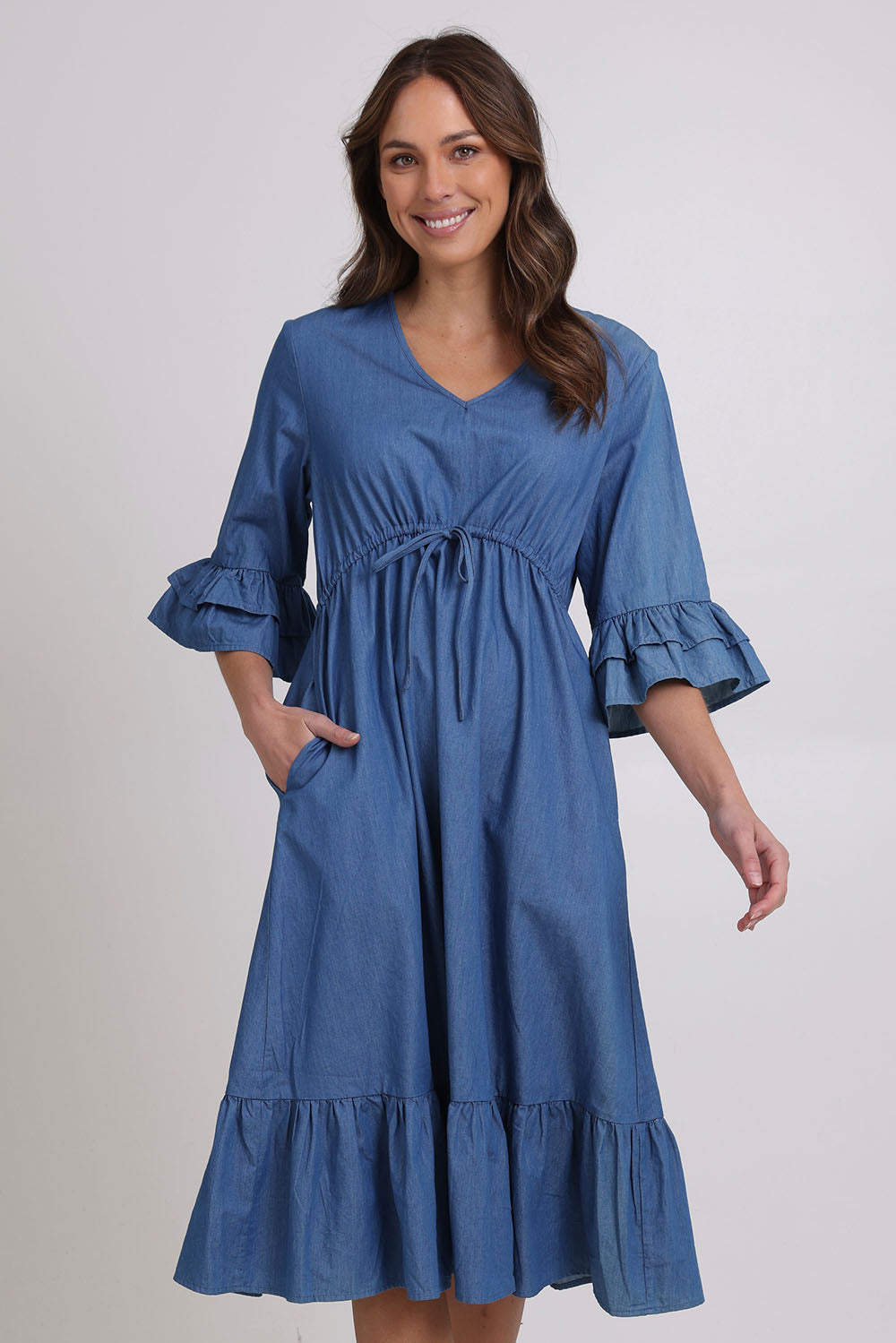 Model Madeline wearing size 10 of the Denim Midi Dress in colour Denim (Blue), from the front, cropped image