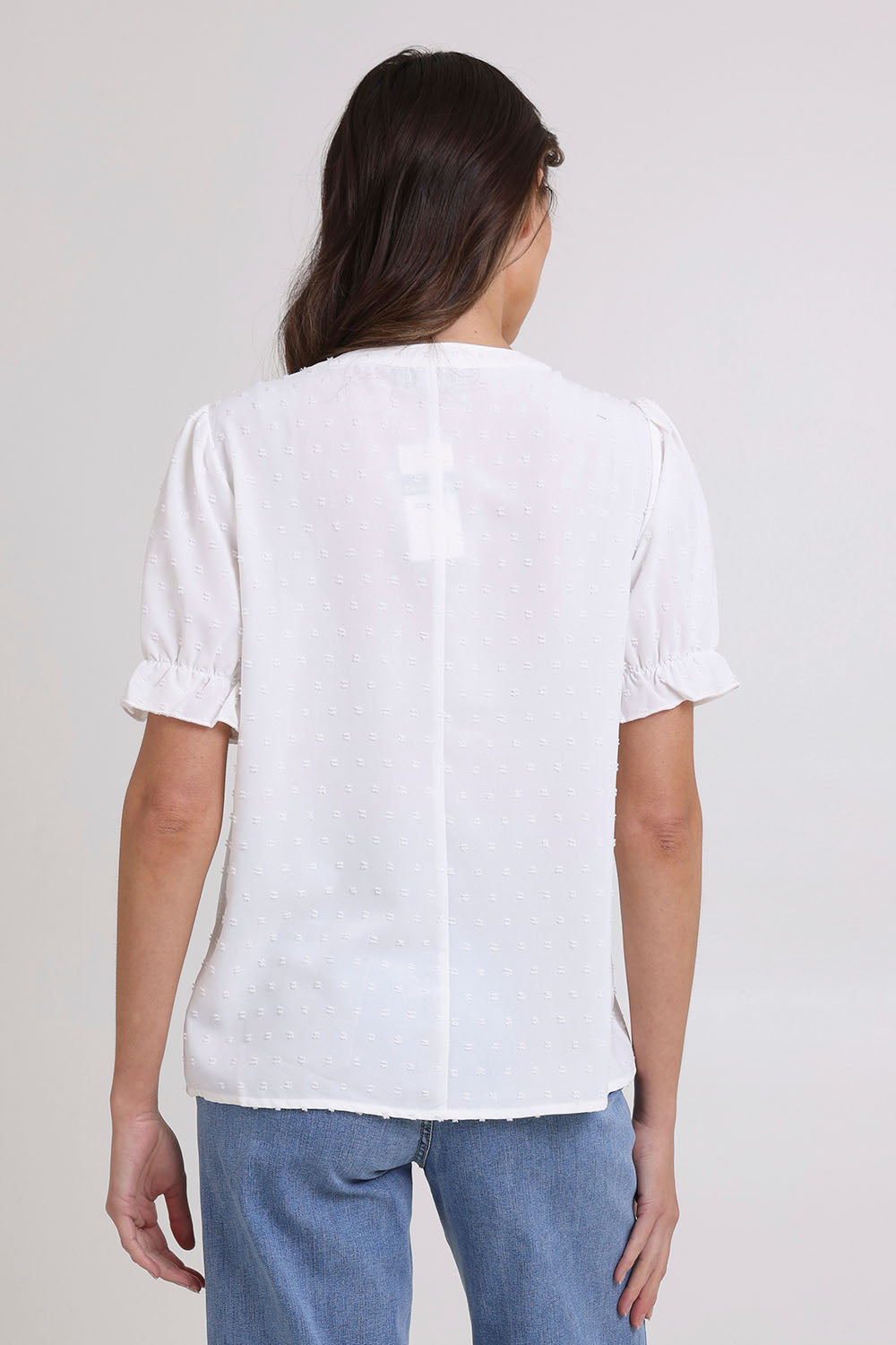 Model Madeline wearing size 10 of the Embroidered Dobi Top in colour White (White), from the back