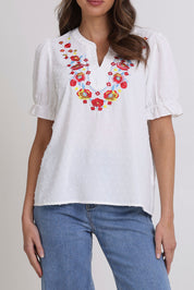 Model Madeline wearing size 10 of the Embroidered Dobi Top in colour White (White), from the front, cropped image