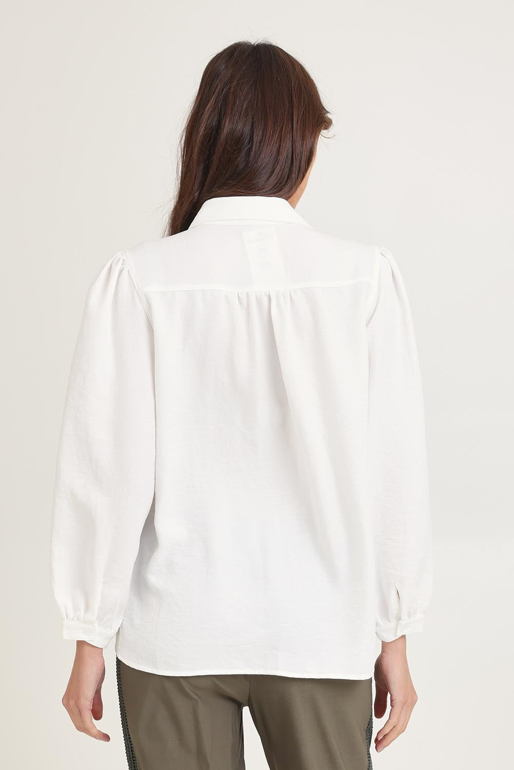 Model Madeline wearing size 10 of the Core Season Top in colour White (White), from the back