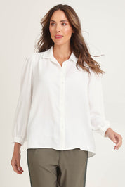 Model Madeline wearing size 10 of the Core Season Top in colour White (White), from the front, cropped image