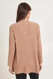 Model Madeline wearing size 10 of the Knit Core Cardy in colour Beige, from the back