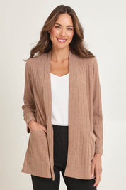 Model Madeline wearing size 10 of the Knit Core Cardy in colour Beige, from the front, cropped image