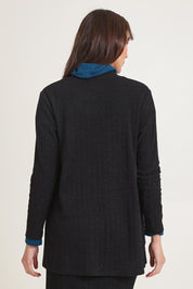 Model Madeline wearing size 10 of the Knit Core Cardy in colour Black (Black), from the back