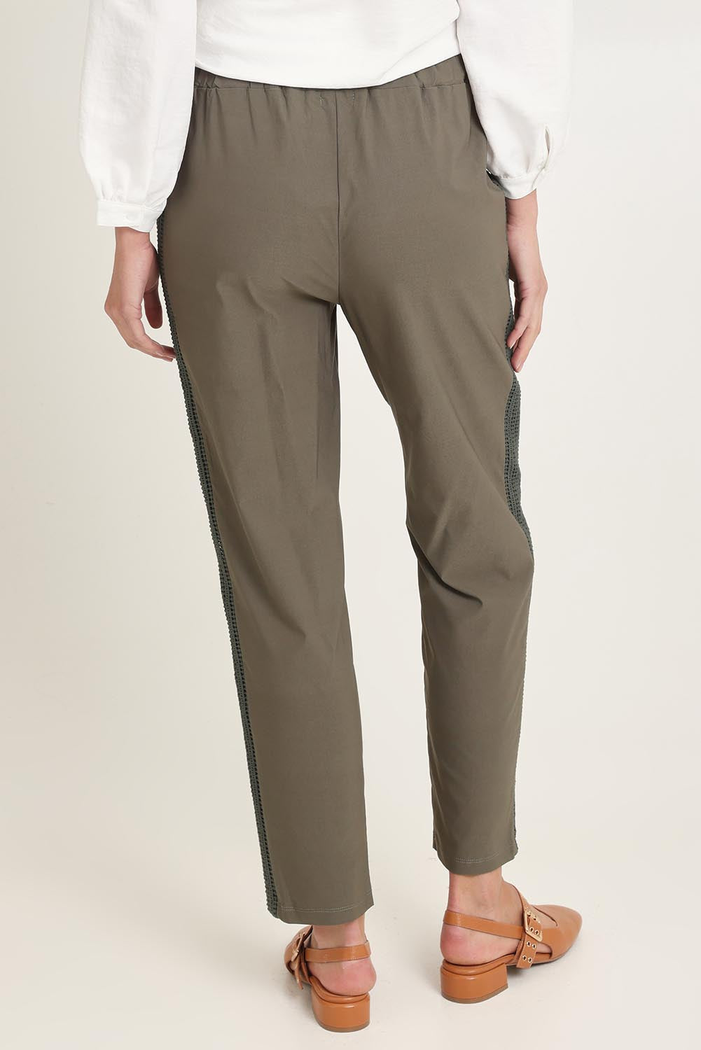 Model Madeline wearing size 10 of the Stretch Jeanie Pant in colour Khaki (Green), from the back