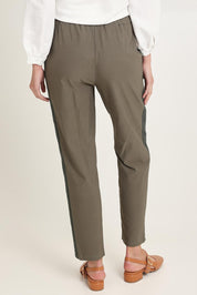 Model Madeline wearing size 10 of the Stretch Jeanie Pant in colour Khaki (Green), from the back