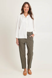 Model Madeline wearing size 10 of the Stretch Jeanie Pant in colour Khaki (Green), from the front, showing the whole outfit
