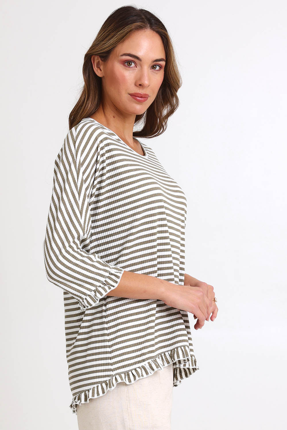 Model Madelinec wearing size 10 of the Stripe Ruffle Top – Bark in colour Bark, from an angle